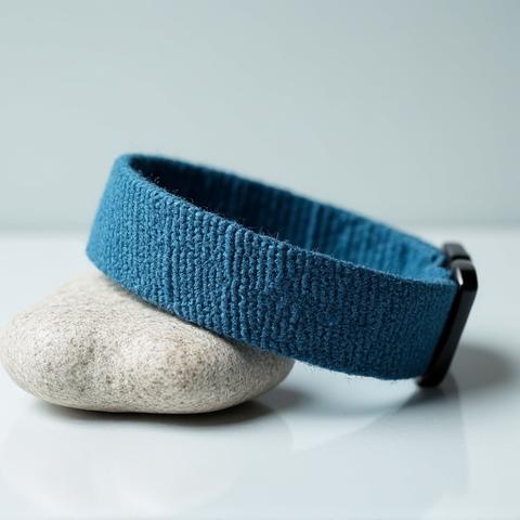 Stylish dog collar made from recycled ocean plastic, in a vibrant blue color.